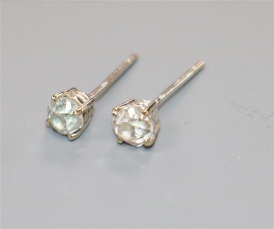A pair of 18ct white gold and solitaire diamond ear studs, no butterflies.